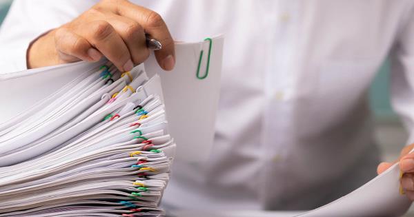 piles of claims processing paperwork